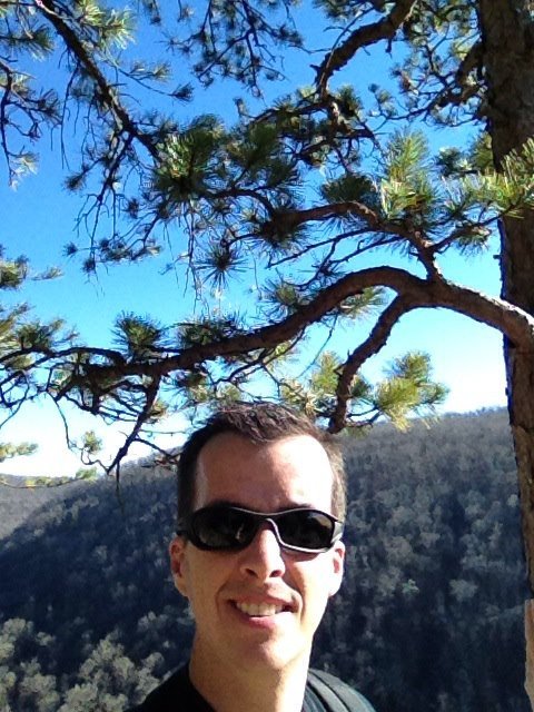 Adam, founder of Adventure Wiser, hiking at Petit Jean