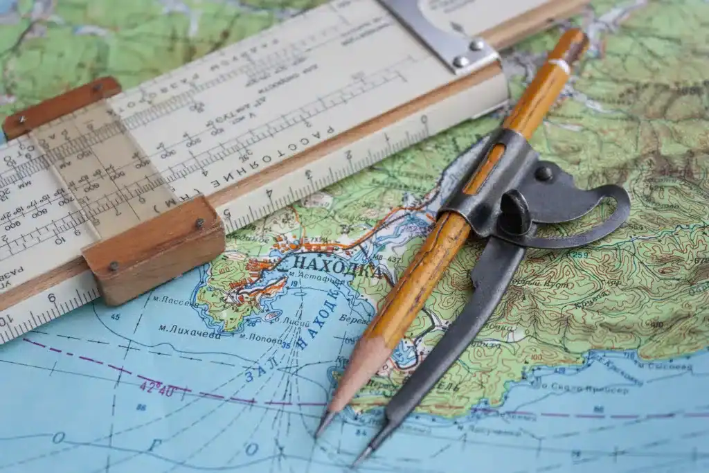 Map and navigational instruments for laying the way.
