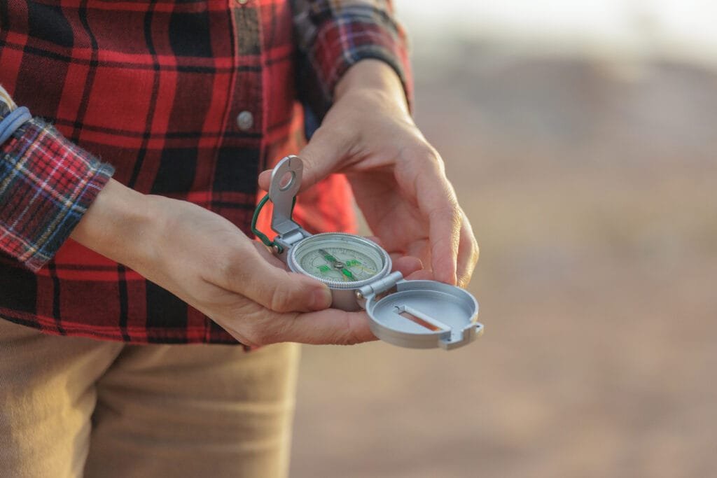 Aligning a compass to take a bearing in the field