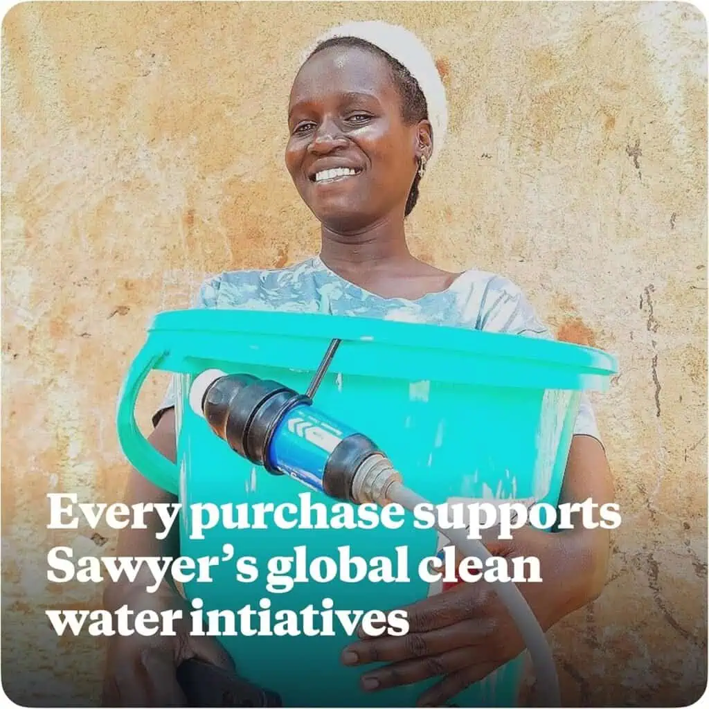 An African woman holding a blue water filter bucket with a tap, promoting Sawyer’s global clean water initiatives.