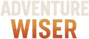 Adventure Wiser logo featuring bold text with a gradient color scheme, representing outdoor adventure and travel expertise.