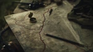 Topographic map with trail route, compass, and navigation tools for tactical pathfinding and outdoor adventure planning.
