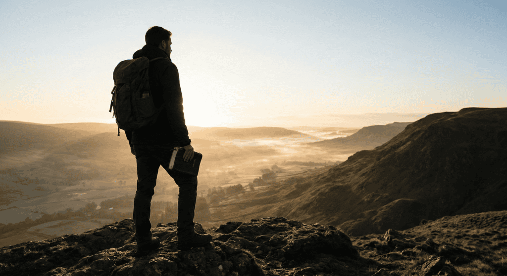 Person overlooking a serene landscape.