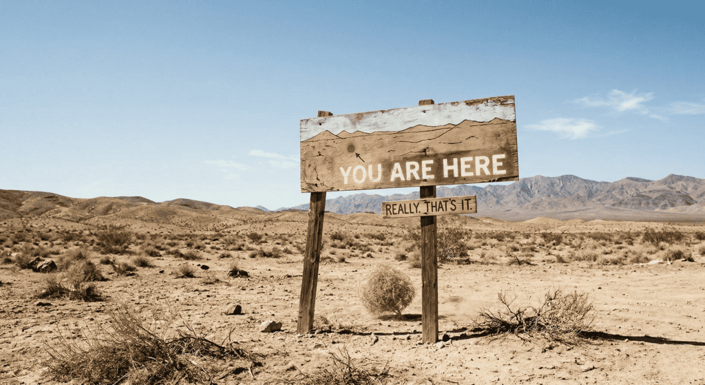 A "You Are Here" sign in the middle of a desolate wilderness, used as a humorous closing visual.